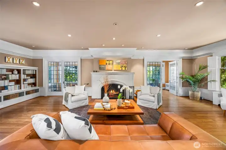 Flooded with light, French doors open wide to seamlessly invite the beauty of nature inside.