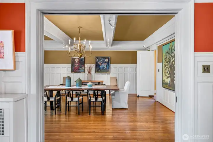 Memorable dinner parties come to life under the glow of the chandelier and classic millwork.