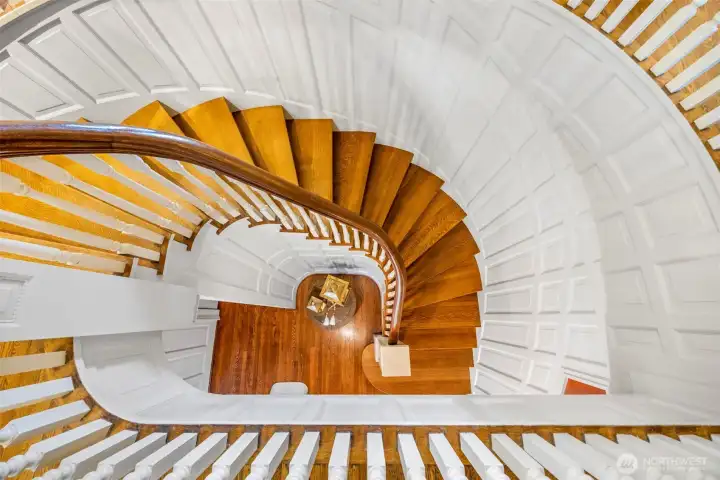 A breathtaking architectural centerpiece, the sweeping spiral staircase showcases remarkable period craftsmanship from above.