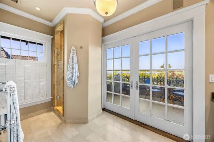 French doors in the upper bath open directly to the fresh air and scenic beauty of the private terrace.