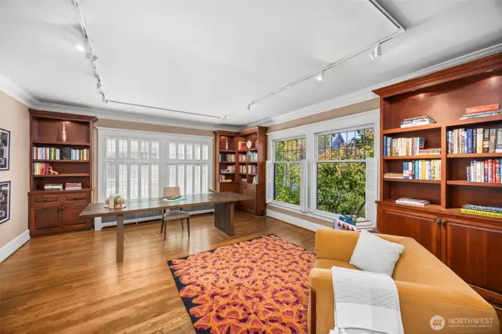 Stately wood built-ins anchor an inspiring home office designed for quiet focus and creative thought.