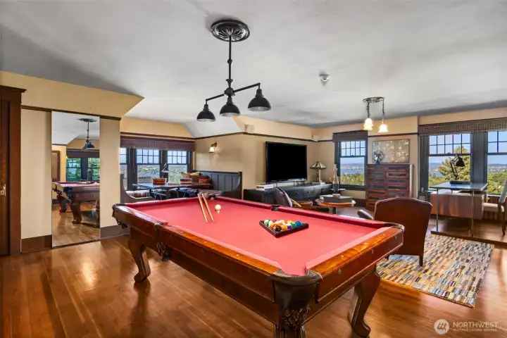 A magnificent billiards room provides the ultimate casual gathering spot, framed by sweeping views.