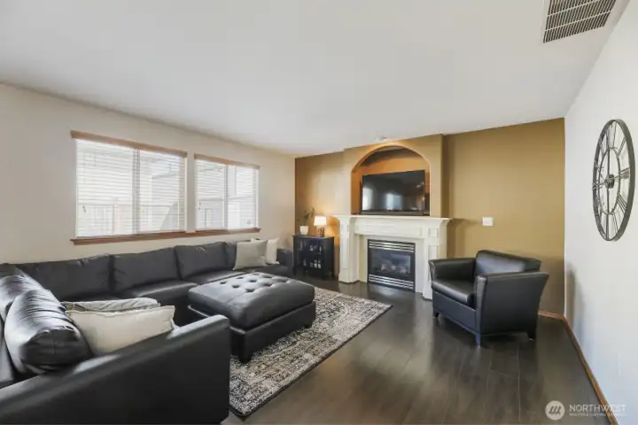 SPACIOUS FAMILY ROOM W/ GAS FIREPLACE & ADJACENT TO A GUEST BATHROOM.