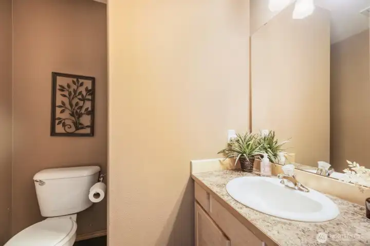 ATTRACTIVE HALF BATHROOM DOWNSTAIRS IS IDEAL FOR GUESTS AND FAMILY.