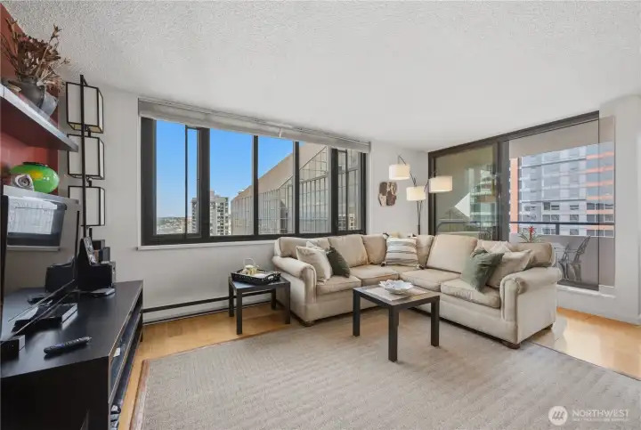 Spacious living area leads to wonderful private deck & separate dining area.