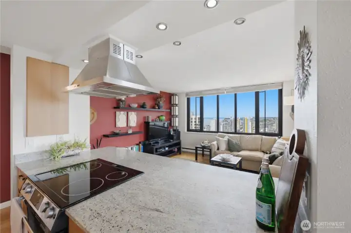 Stunning open kitchen with cool overhead fan looking out to the views!