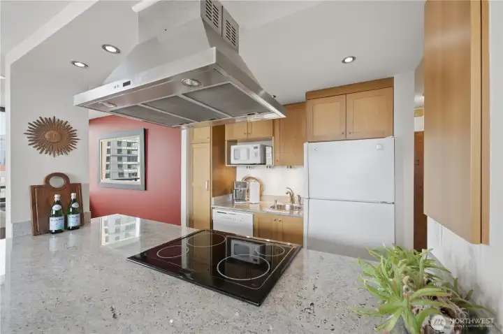 A close-up photo of the awesome kitchen with built-in pantry & eating bar too.
