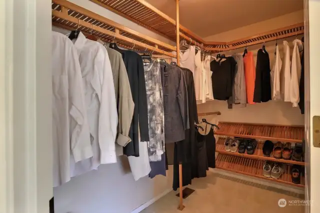 The primary closet is well-designed for keeping your clothes and shoes in perfect order.