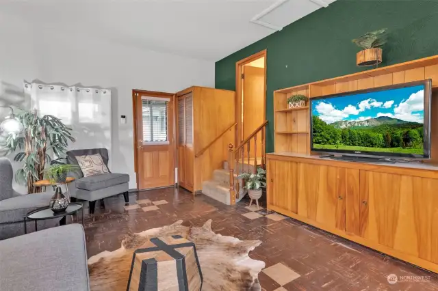 Family room with door to covered backyard deck.