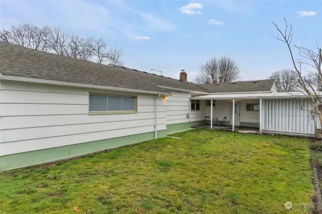 Backyard with covered deck.