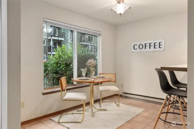 Dining area off the kitchen - view of the pool, can be private with blinds/curtains