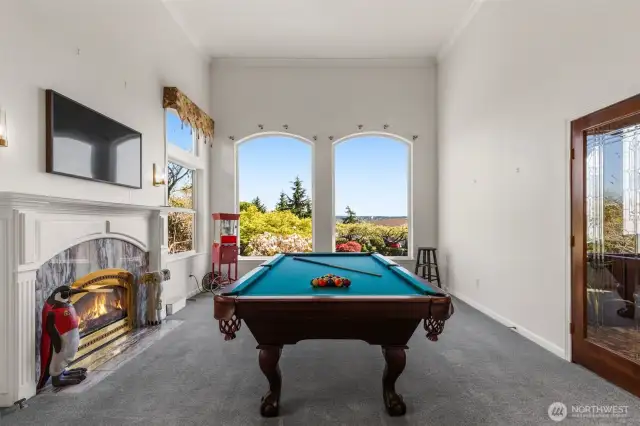 family/additional living room complete with fireplace & great views.