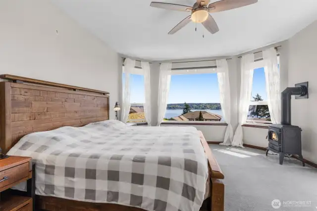 Spacious primary suite with 2 walk in closets, private bath & gas fireplace. The views are something special to wake up to!