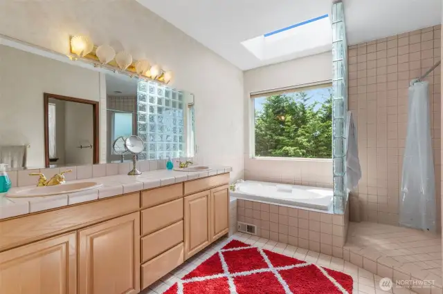 Primary bath features dual sinks & separate tub & huge shower!