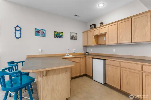 Wet bar off of the game room.