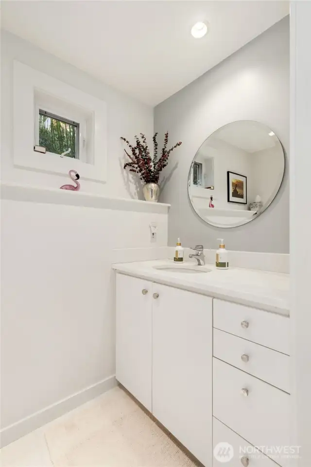 Crisp, clean & sharp! Half bath/powder room off kitchen.