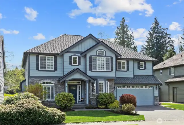 Excellent curb appeal with stack stone and board and batten detail.
