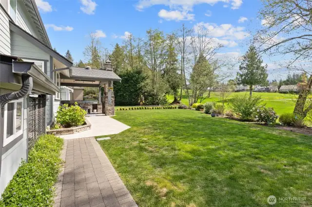 Paver walkway and custom built-to-match doghouse or additional storage space.