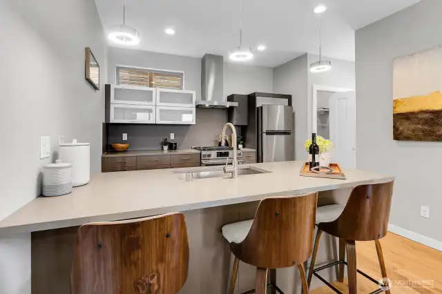 Larger center island with breakfast seating counter.