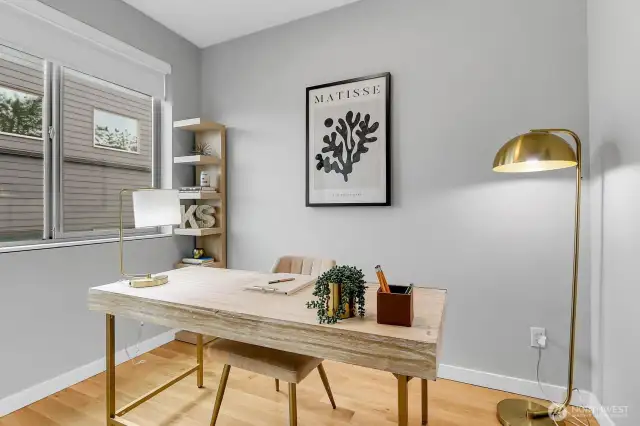 2nd bedroom with full closet on upper floor staged as den/office