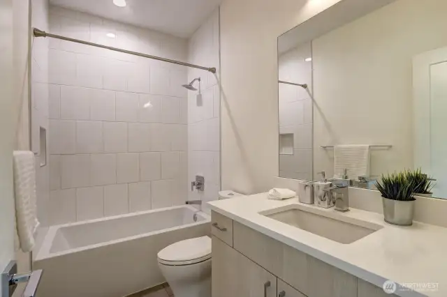 A hall bath on upper floor next to 2nd bedroom