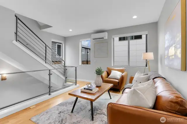Main living room features quality engineer hardwood flooring throughout!!