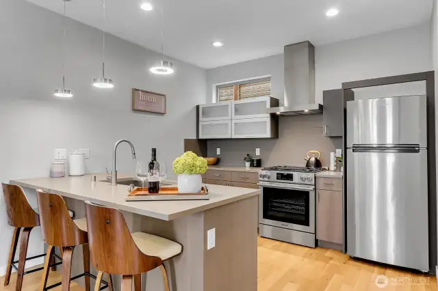 Modern kitchen with center island & quality SS appliances