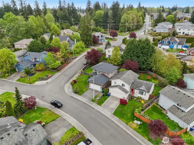 Stunning bird's-eye view of the property, showcasing the spacious yard and prime location