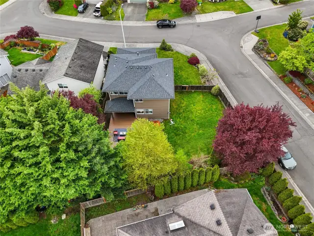 Stunning bird's-eye view of the property, showcasing the spacious yard and prime location