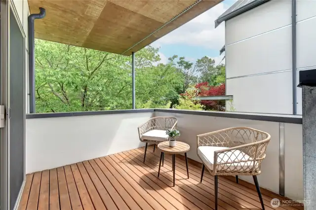 Large covered deck off the upstairs primary bedroom.