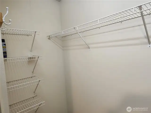 Primary walk-in closet provides plenty of space for your wardrobe!