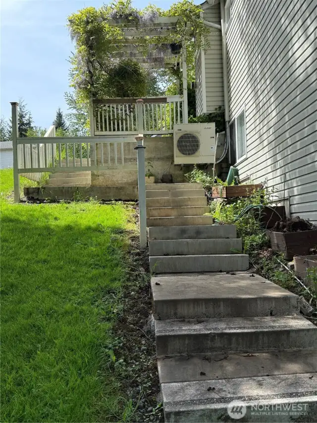 Stairs take you all the way to the backyard and small creek.