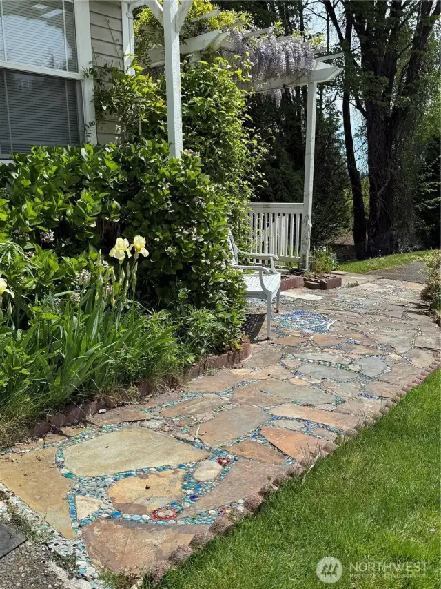 Seller designed this very beautiful stone and glass bead path to the Arbor. Please be careful to steop on the rock stones as the glass beads can be slippery when wet.