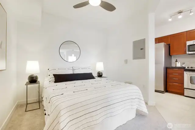 The bedroom easily accommodates a queen bed and features a ceiling fan.