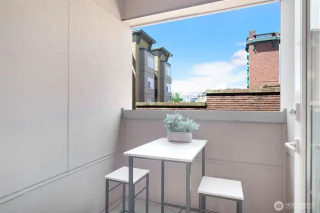 Enjoy the territorial view of the historic Firehouse 18 and the Majestic Bay Theatre from the covered balcony.