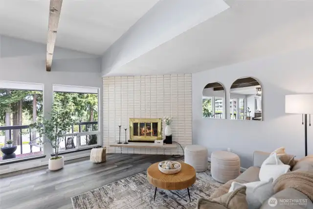 Spacious open floor plan with ceiling to floor windows.