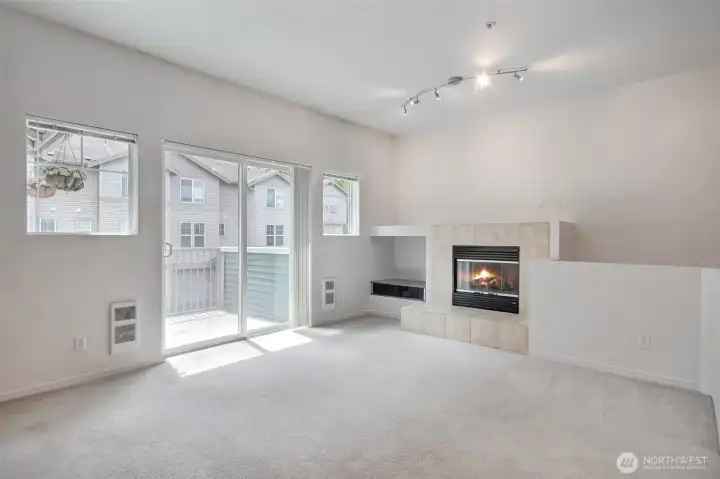 Peaceful living room opens up to private back deck.