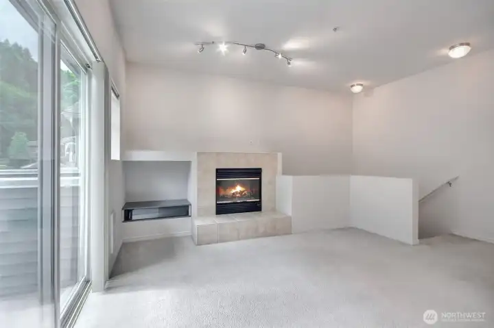 Enjoy a fire in your fireplace with tons of natural lighting.