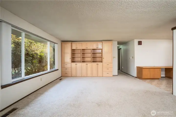 View of dining room from the living room area with the hall that leads to the 3 bedrooms and main bath.