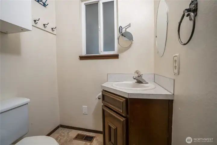 Half bath across from the utility area