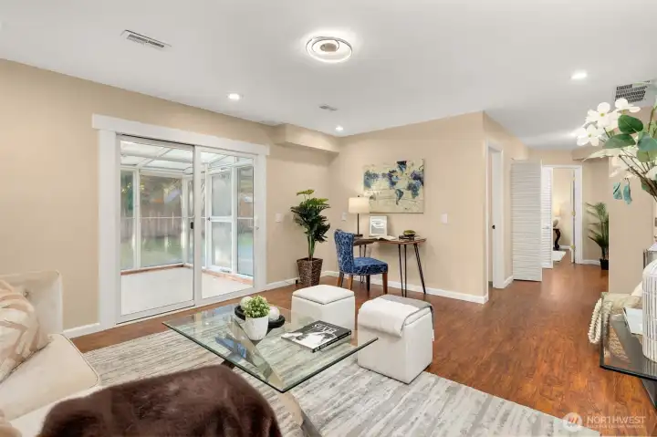 Lower level rec room with heated floors and the slider to the sunroom