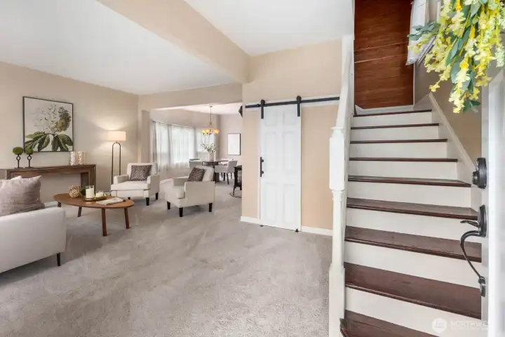 This gorgeous home welcomes you in with new carpet and an easy layout including a spacious entryway coat closet.