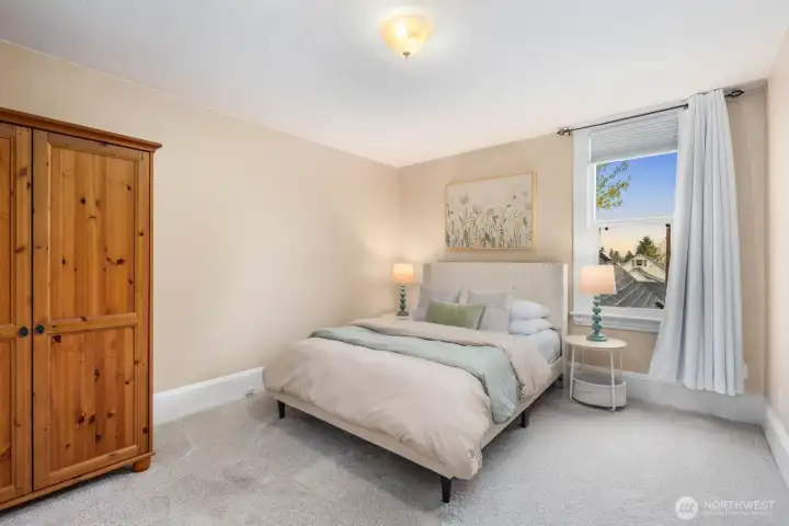 Upstairs find two more spacious bedrooms. Armoire can stay with the buyer.