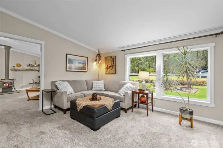 Large second living area has large windows, custom lighting and a great layout for flex space