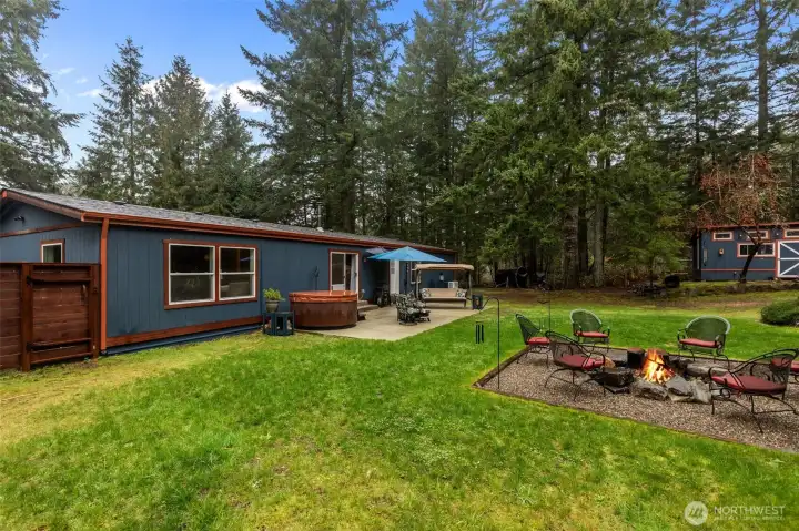 The backyard won't disapoint! With over two acres, the backyard is fully fenced with room still to EXPAND!