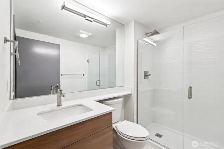 Convenient three-quarter guest bath featuring a sleek, modern walk-in shower