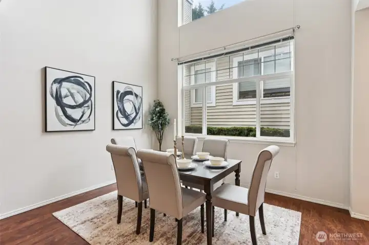 Impressive dining space with soaring ceilings and abundant natural light