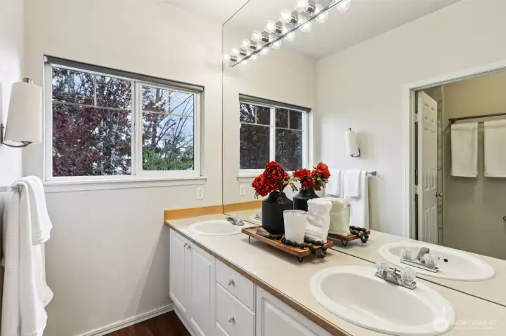 Primary bathroom with dual vanity, separate shower, and functional layout