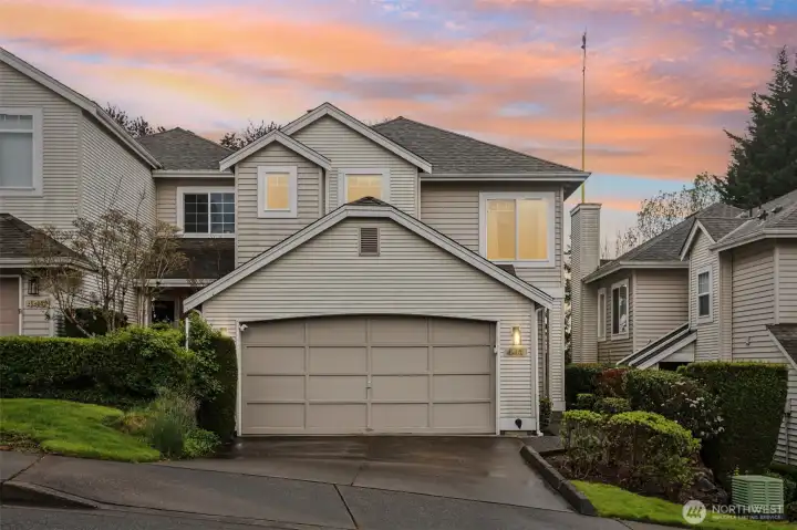 Beautifully lit exterior at dusk creating a warm and inviting first impression