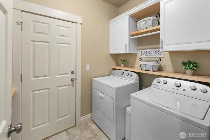 Laundry Room w/ Storage Cabinets, Shelving, Sink and Counter space to fold clothes. Garage access too.